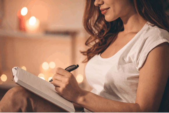 Woman organizing her life and journaling